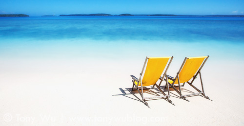 Beach chairs on white sand, Mounu Island Resort, Tonga