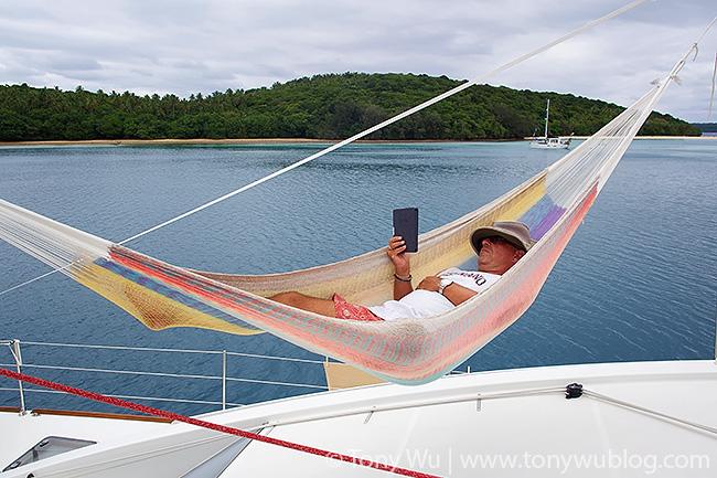 Julian Cohen reading in hammock aboard Bella Principessa